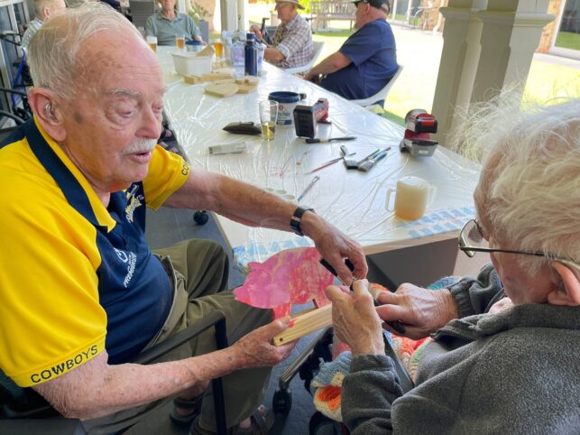Residents at Woodford Manor aged care enjoying summer activities
